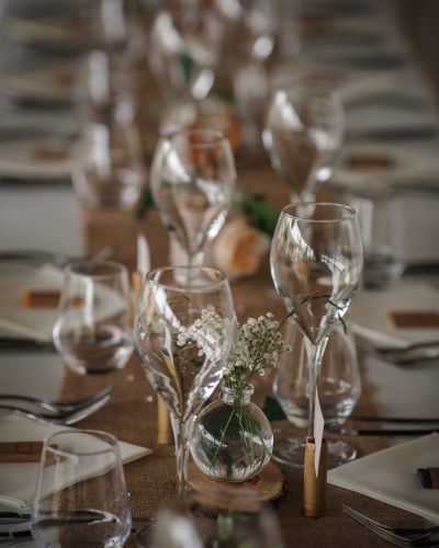 Outdoor catering dinner at the wedding with homemade garnishes decoration